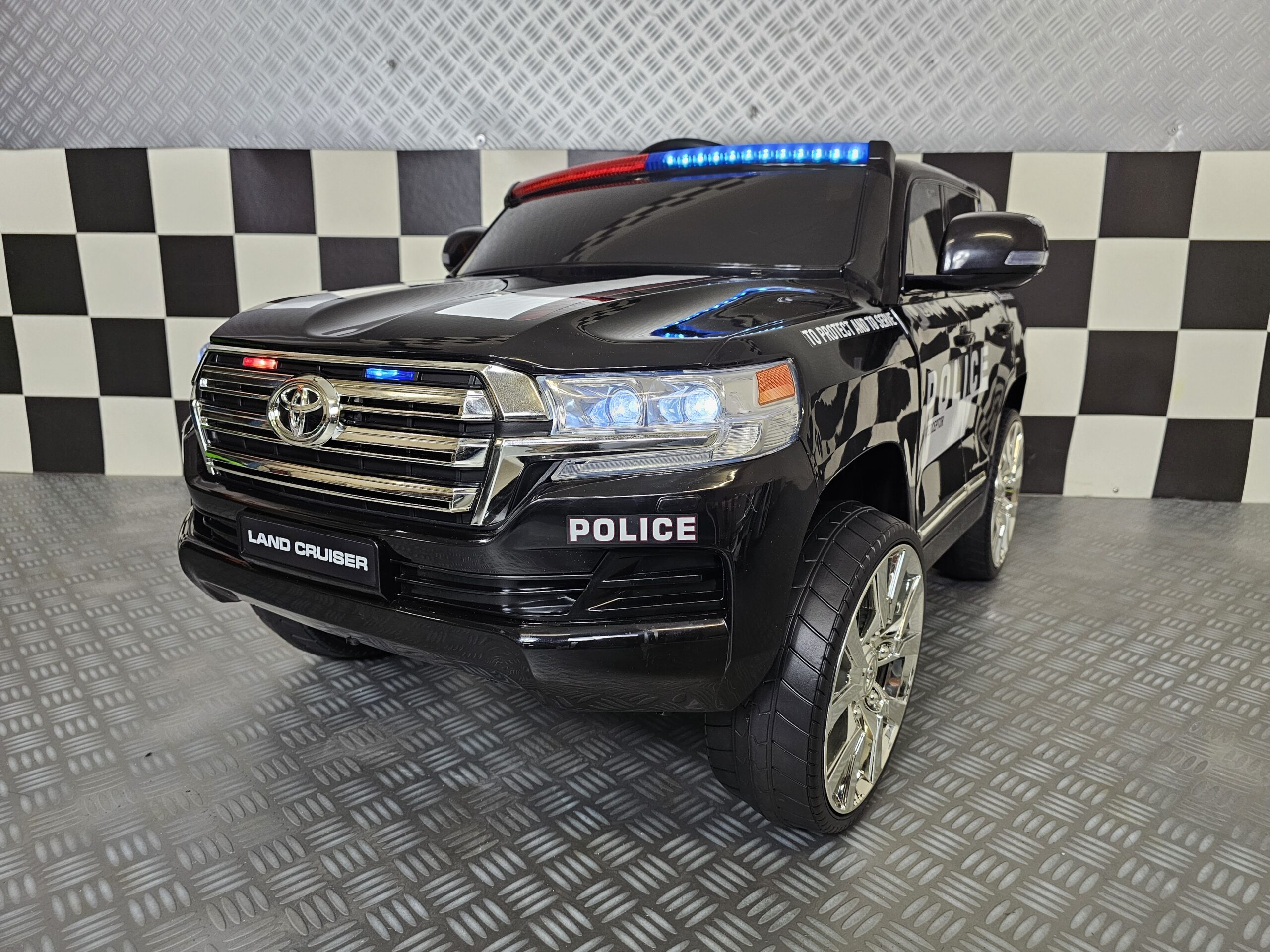 Kinderauto Toyota Land Cruiser politie 24 volt